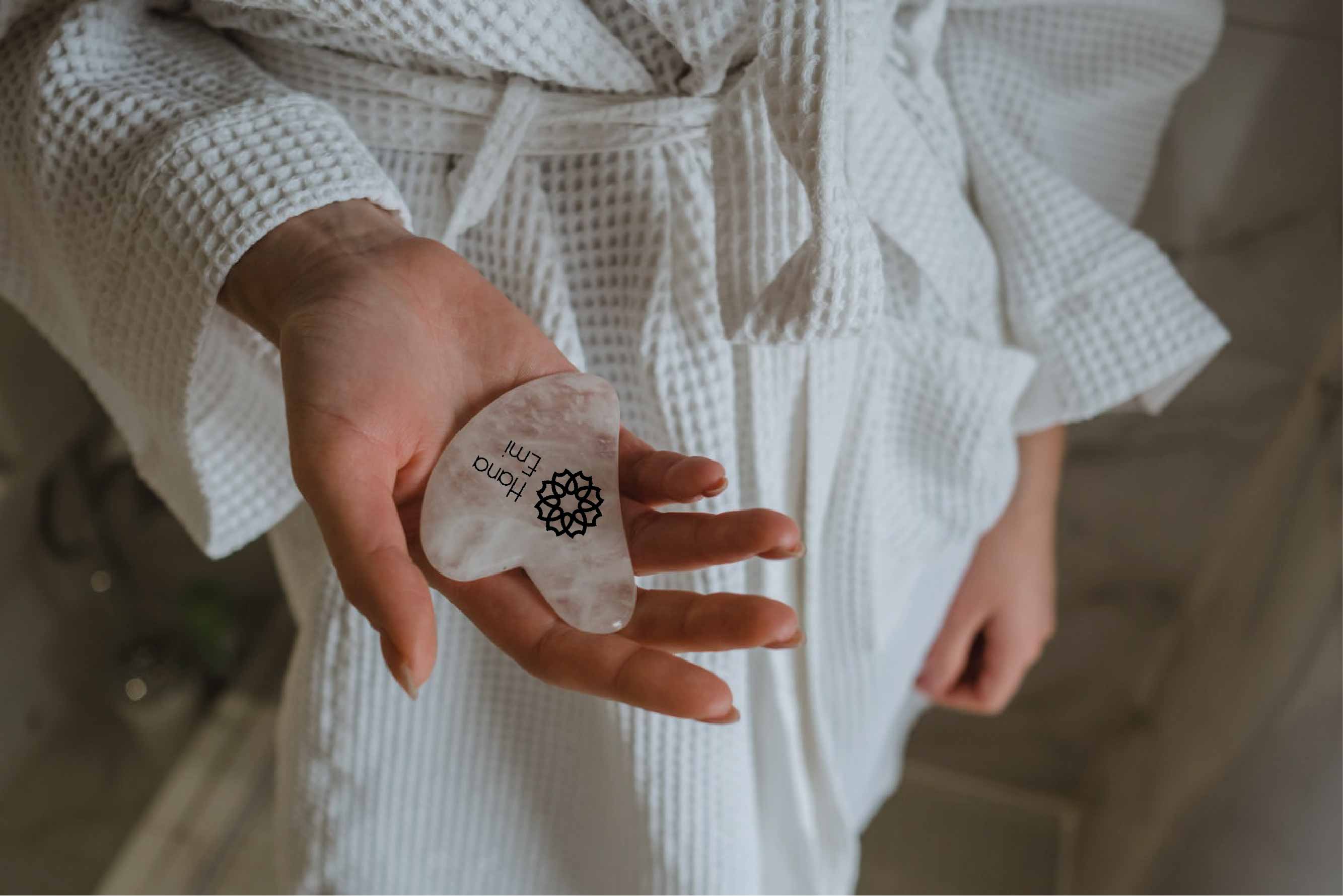 Girl holding Gua sha in her hand